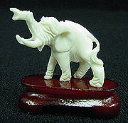 SINGLE ELEPHANT W/BASE # (9809)
Originally Sold For $20!
This is an Elephant Bone carving. All hand carved with details. Elephant is standing on a wood stand.