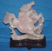  HF02, rose quartz double horses. This horse is made from one piece solid Rose Quartz. This is a very beautiful unique solid 1 piece stone carving. It comes with a wooden base. 
SIZE: Call.. price: $360.00 + S/H from NY
Click Here To See Big Picture.
