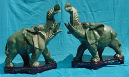 HUGE! PAIR OF 26 inch VALUABLE GREEN JADE ELEPHANTS # ( HJ031D )
THE LOVELY PAIR OF ELEPHANTS WERE MADE OF BEAUTIFUL GREEN JADE. IT HAS A GLOSSY SURFACE. THIS PAIR OF ELEPHANT IS RESTING ON A BEAUTIFUL ROSEWOOD BASE. Size =  L: 27 in, W: 10 in, H: 26 in. Price = $995.00+ S/H
