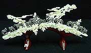 ZEBRAS BRIDGE (9908)
-This bone carving is made of elephant bones. 12 zebras are carved on a jungle. All hand carved with lots of details. 
Size: L:15 in, W:5 in, H:7 in
 US$125.00 + S/H
Click Here To See Big Picture.