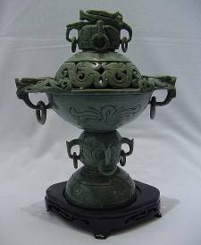  Jade Dragon Urn Vase (LX02) $99.99 + S/H.
This is a Beautiful Solid Green Jade Vase carving, all hand carved with many details. A Dragon sits on its top.With Dragons around the side.
Size: H: 13 in, W: 10 in, D: 7 in.
Click Here To See Big Picture.