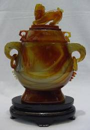  Jade Dragon Urn Vase (MP01) $599.99 + S/H.
This is a Beautiful Solid Agate Vase carving, all hand carved with many details. A Kylin sits on its top.
Size: H: 12 in, W: 8 in, D: 4 in.
Click Here To See Big Picture.