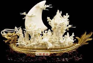 Item No ( 01B2 ) 24 inches long. An Exquisite Bone and Gold Dragon Boat Carving Handmade in China Click on the dragon to see a larger picture.