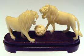 BONE LIONS elephant bone carving.
 L: 3in, H: 2in, W: 1in.